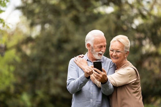 Senior couple using smartphone
